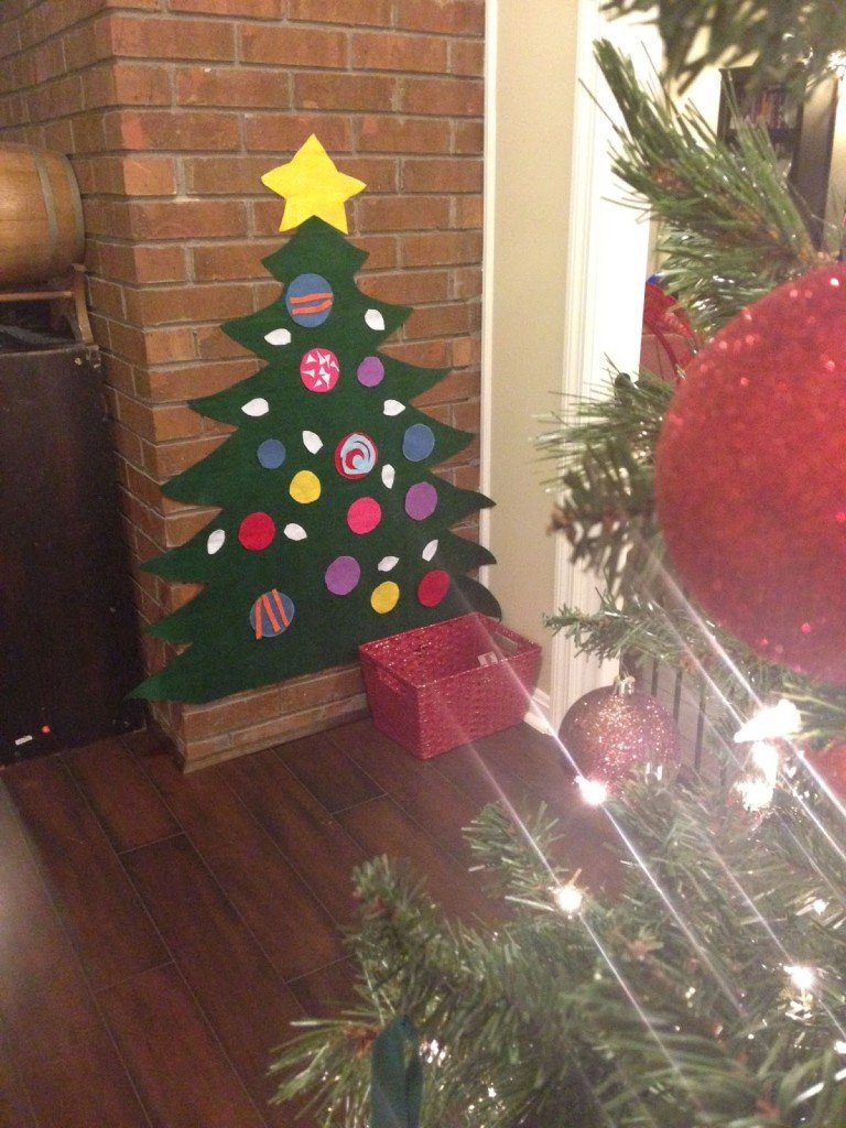 If your regular Christmas tree is a hands-off zone for your toddler, make them their very own DIY Felt Christmas Tree so they can play and go to town!
